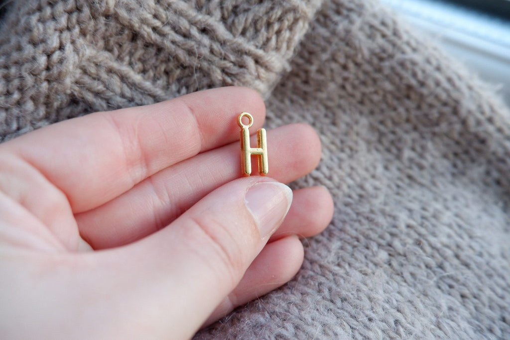 "H"-bogstav-markør (gylden)