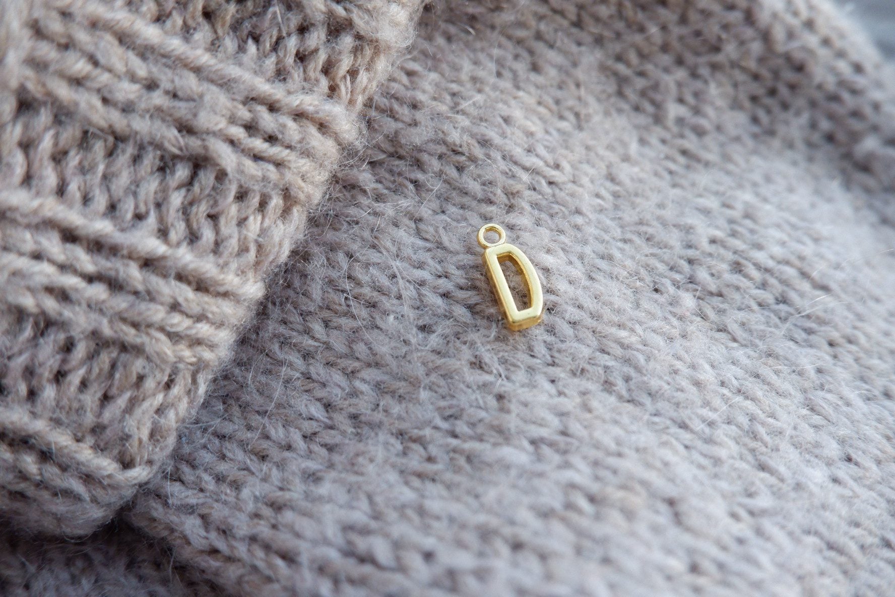 "D"-bogstav-markør (gylden)