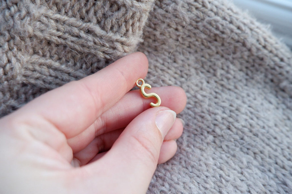 "S"-bogstav-markør (gylden)