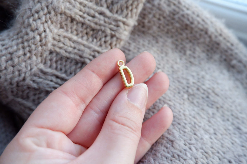 "D"-bogstav-markør (gylden)