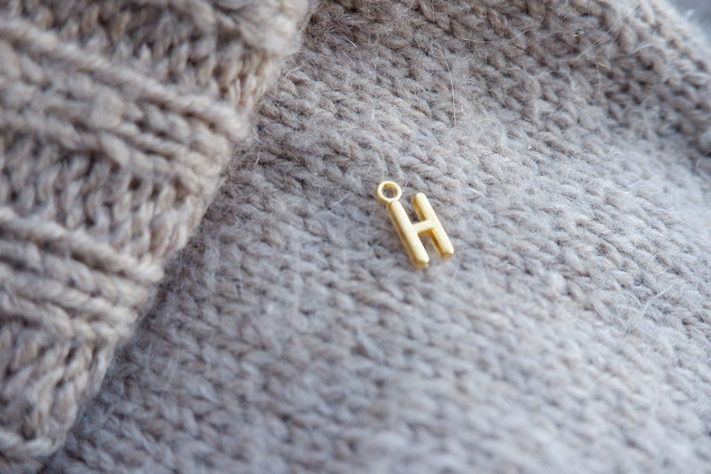 "H"-bogstav-markør (gylden)