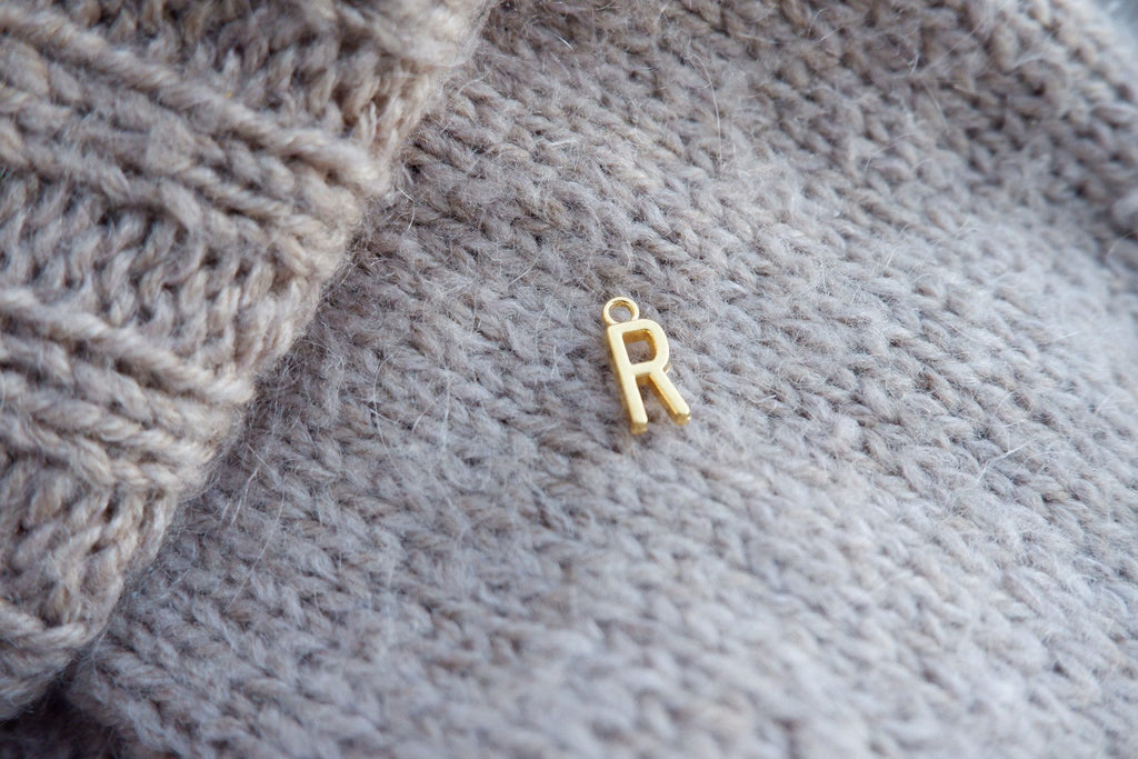 "R"-bogstav-markør (gylden)