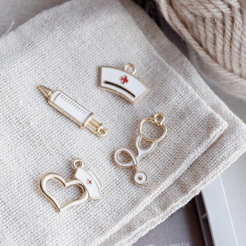 Stetoskop-markør (guld - metal)