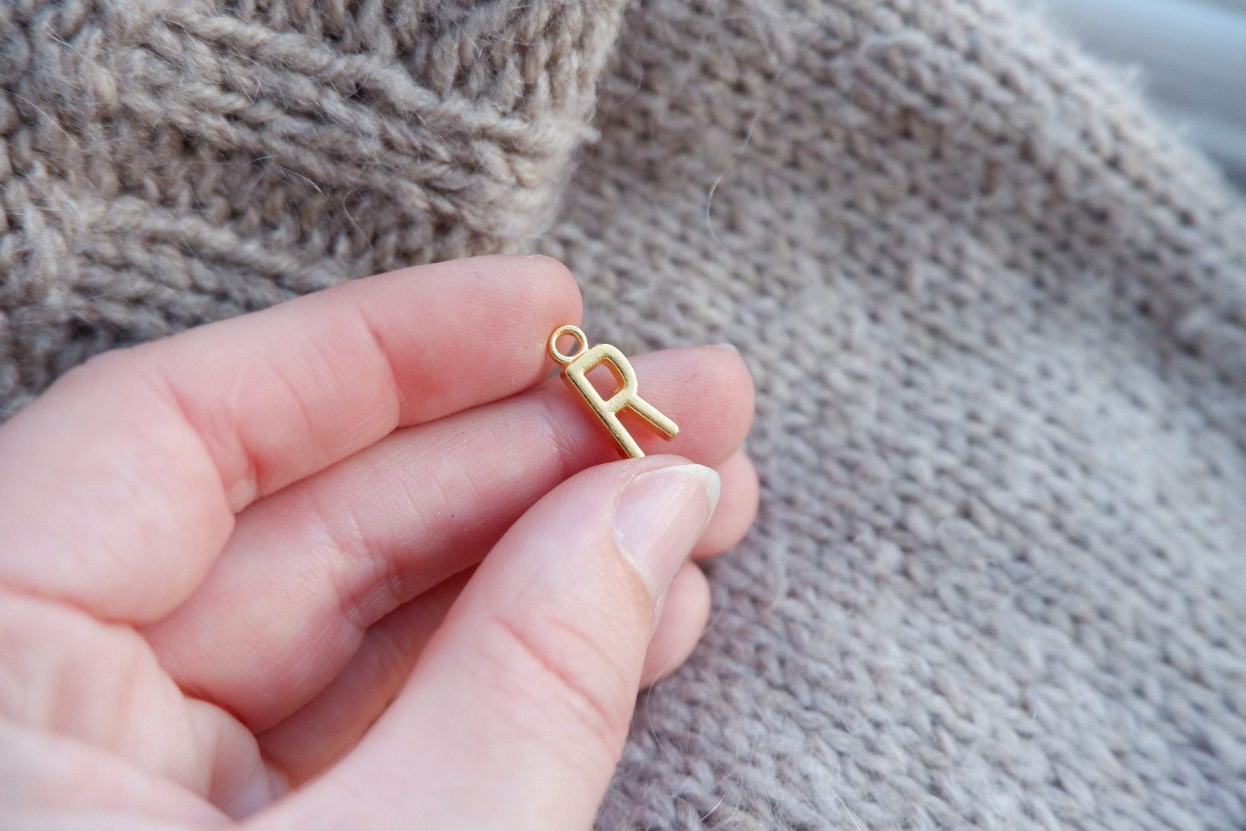 "R"-bogstav-markør (gylden)