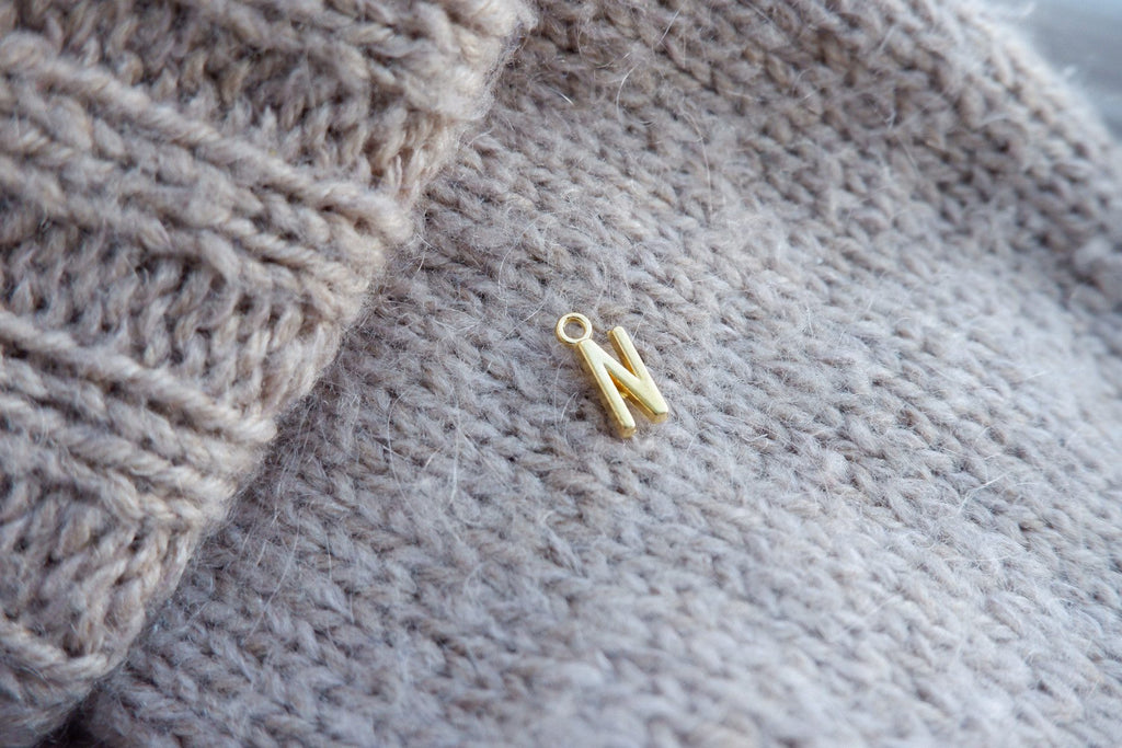 "N"-bogstav-markør (gylden)