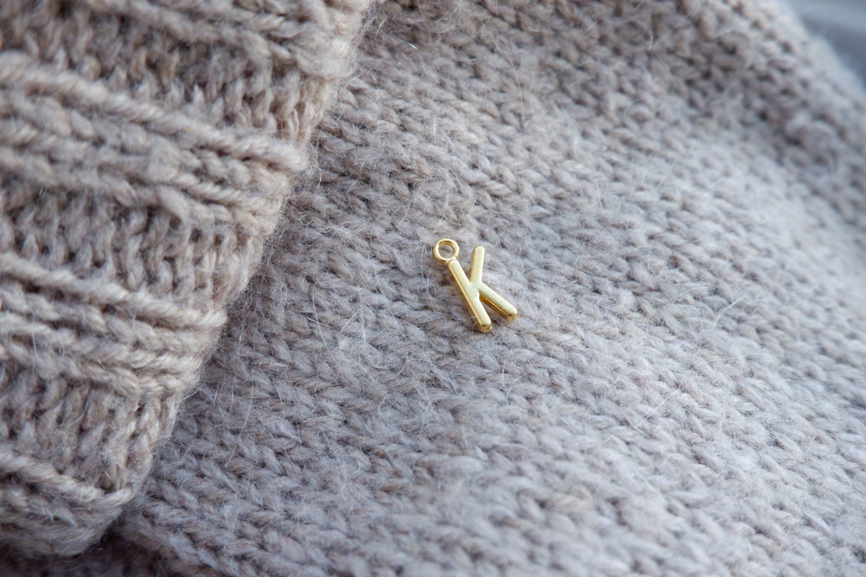 "K"-bogstav-markør (gylden)