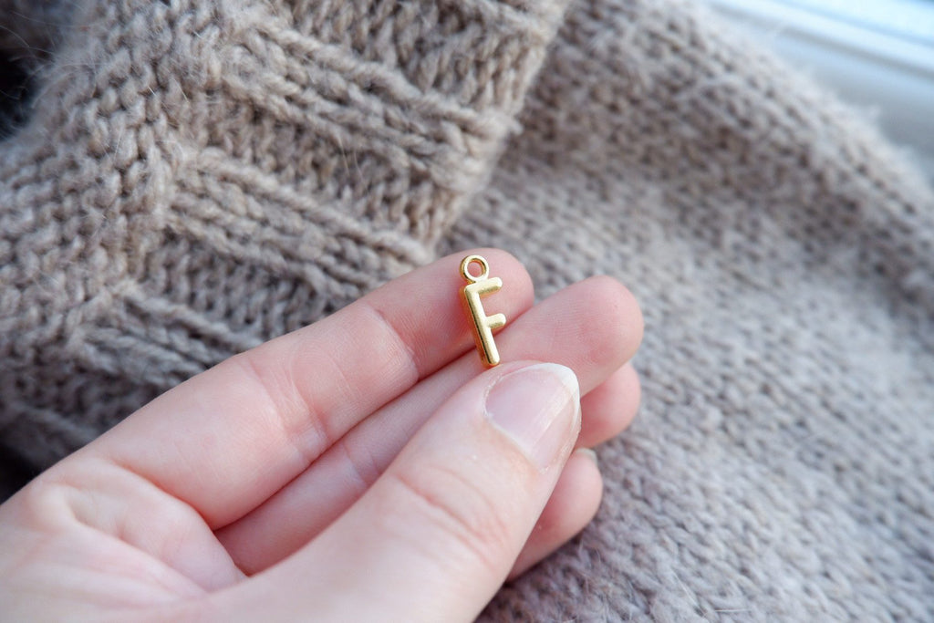 "F"-bogstav-markør (gylden)