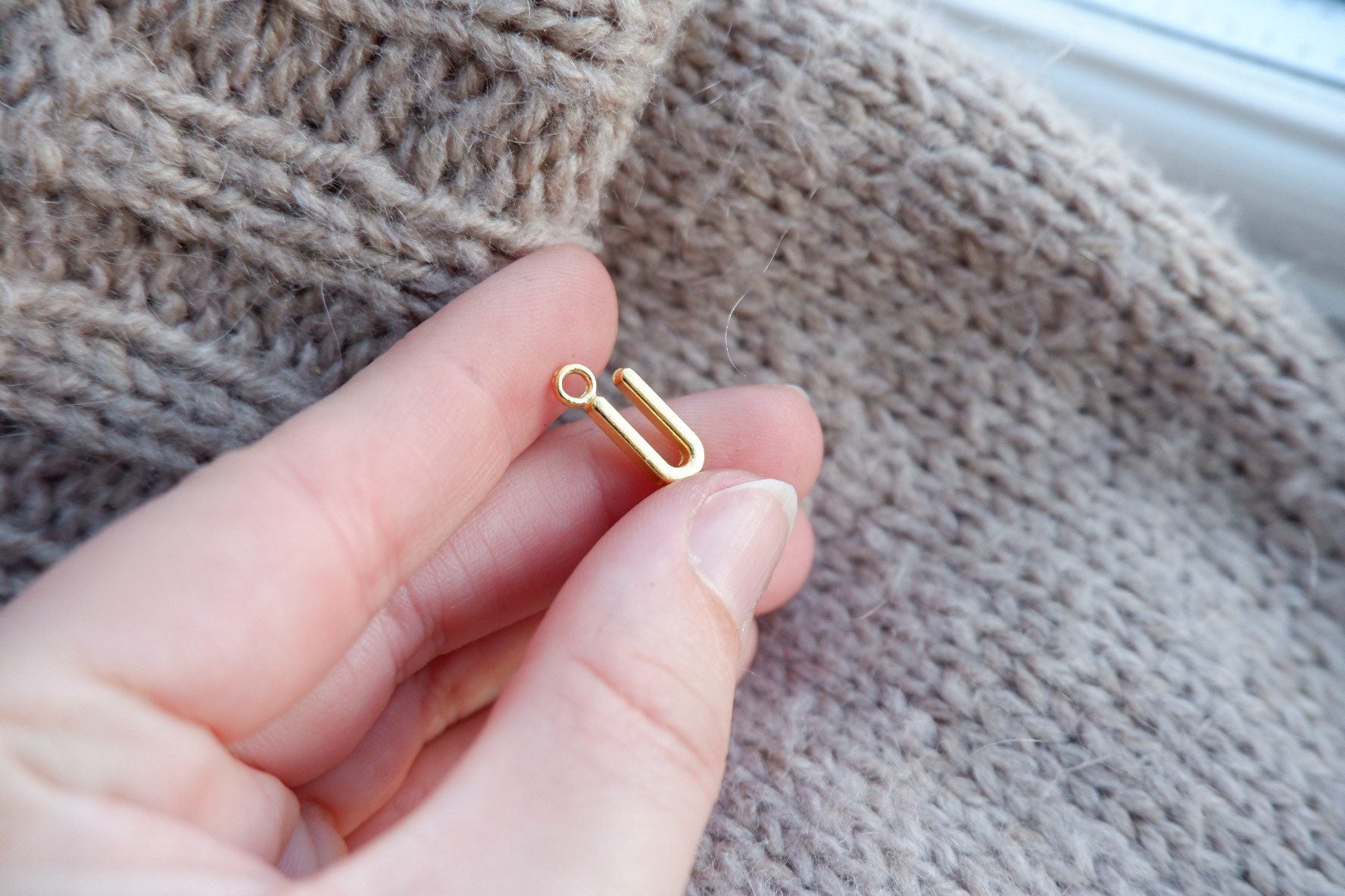 "U"-bogstav-markør (gylden)