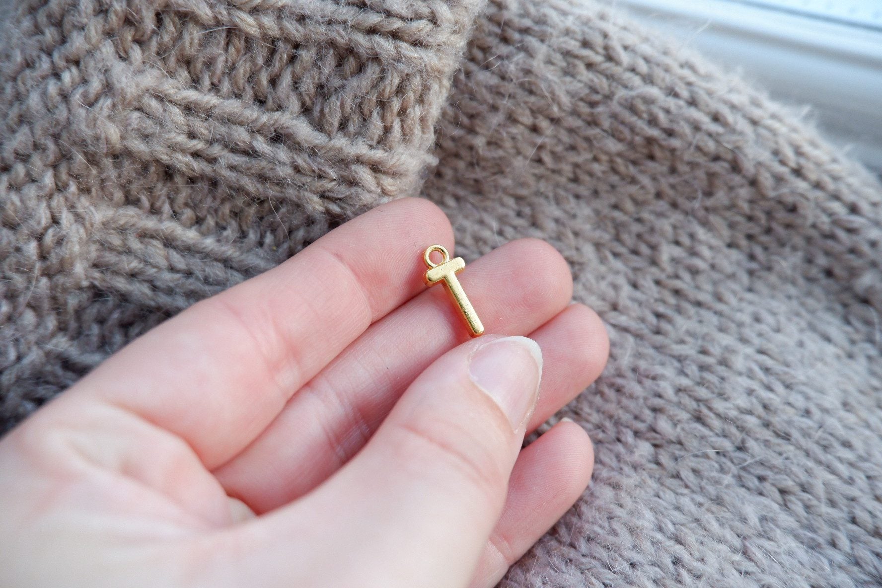 "T"-bogstav-markør (gylden)