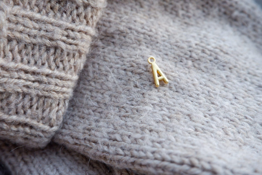 "A"-bogstav-markør (gylden)