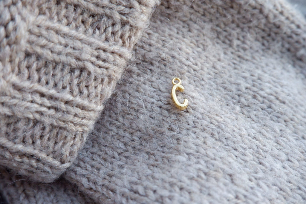 "C"-bogstav-markør (gylden)