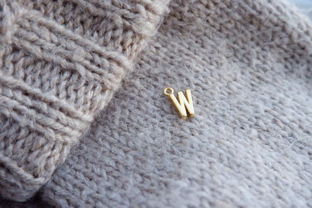 "W"-bogstav-markør (gylden)