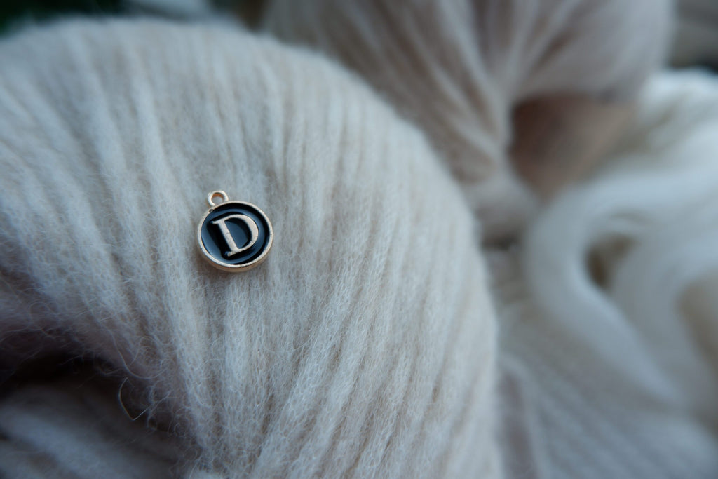 "D"-bogstav-markør (sort)