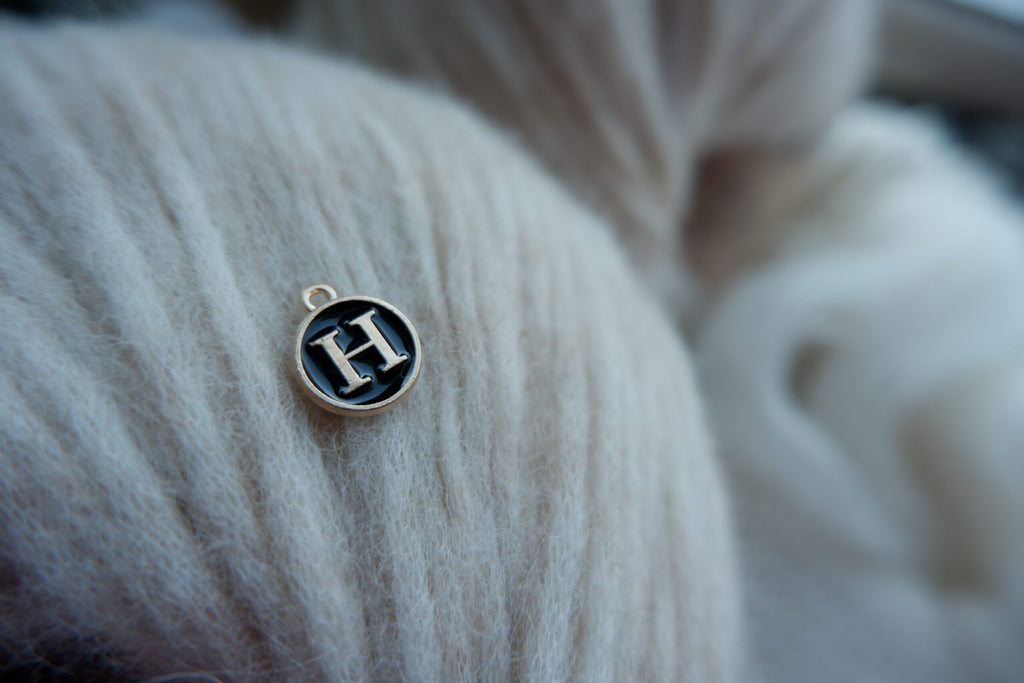 "H"-bogstav-markør (sort)