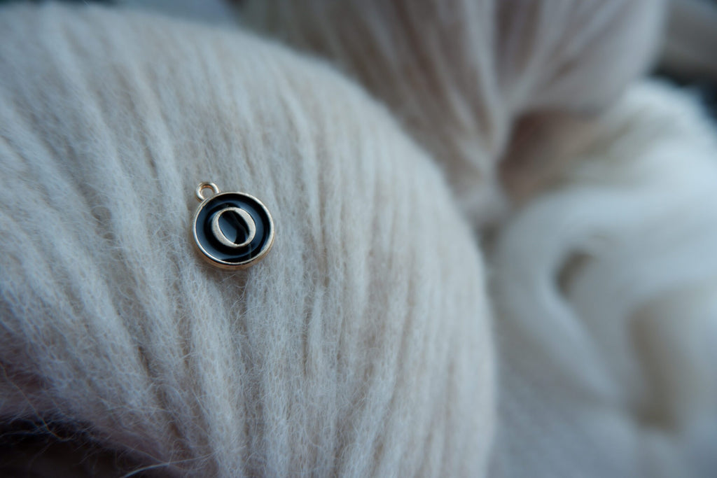 "O"-bogstav-markør (sort)