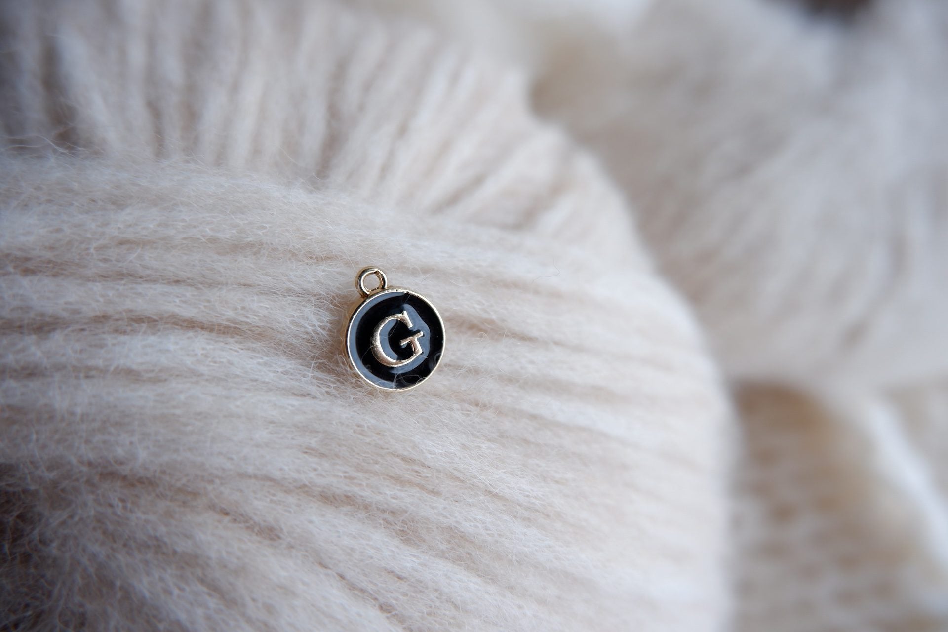 "G"-bogstav-markør (sort)