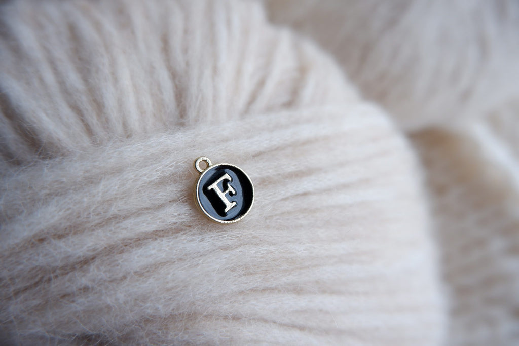 "F"-bogstav-markør (sort)