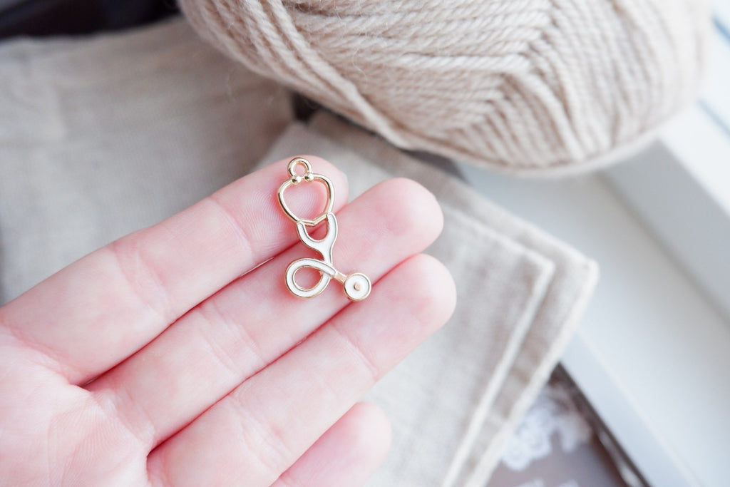 Stetoskop-markør (guld - metal)