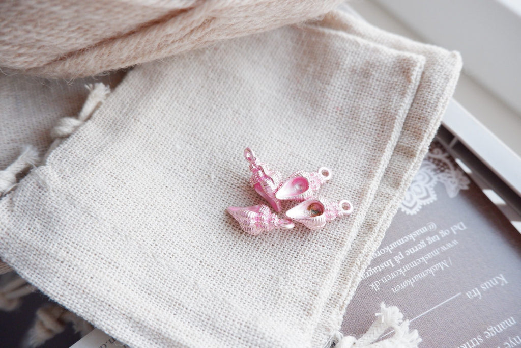 Konkylie-markør (lyserød - metal)