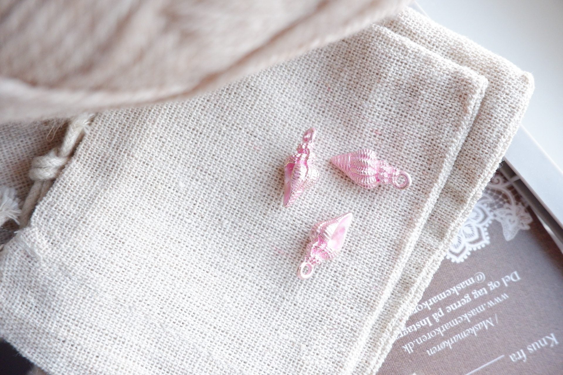 Konkylie-markør (lyserød - metal)