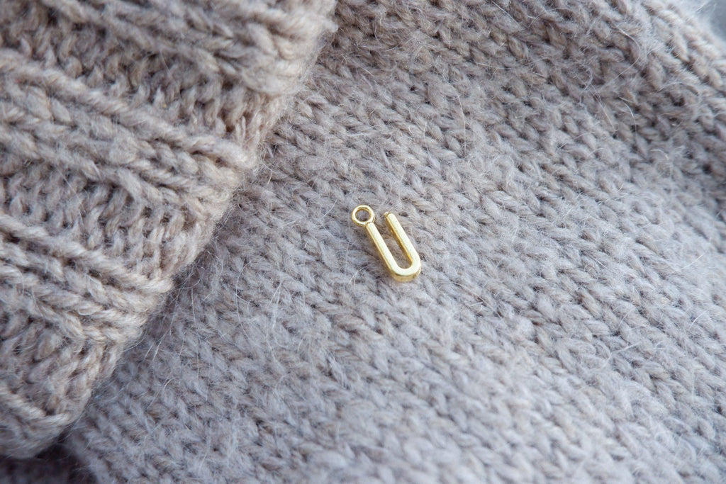 "U"-bogstav-markør (gylden)