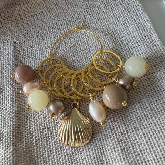 Raglansæt (gyldent med hjertemuslinge-markør)